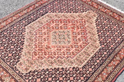 Lot 333 - Middle eastern woollen rug, label verso 'Tapis Fait Main' 152cm x 125cm