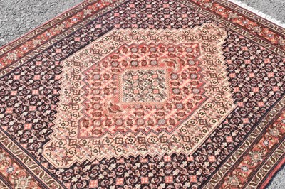 Lot 333 - Middle eastern woollen rug, label verso 'Tapis Fait Main' 152cm x 125cm