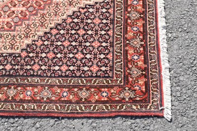 Lot 333 - Middle eastern woollen rug, label verso 'Tapis Fait Main' 152cm x 125cm