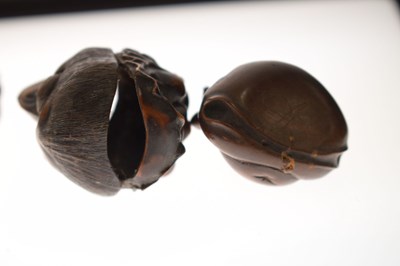 Lot 257 - Two Japanese carved boxwood netsuke and a carved nut in the form of two faces