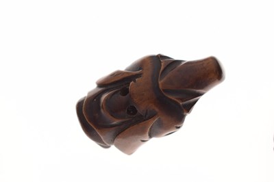 Lot 257 - Two Japanese carved boxwood netsuke and a carved nut in the form of two faces