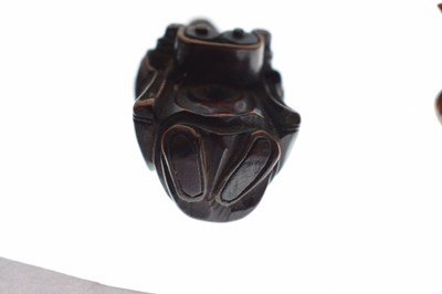 Lot 257 - Two Japanese carved boxwood netsuke and a carved nut in the form of two faces