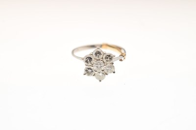 Lot 6 - 18ct white gold seven-stone diamond daisy cluster ring