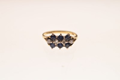 Lot 8 - Sapphire and diamond 18ct gold cluster ring