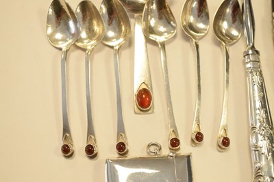 Lot 165 - Set of six Elizabeth II silver teaspoons set cabochon with matching caddy spoon