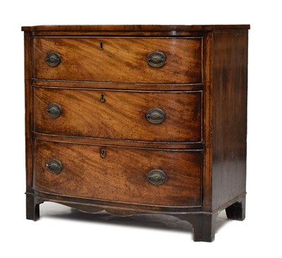 Lot 562 - George III inlaid mahogany bow-breakfront chest of three long drawers