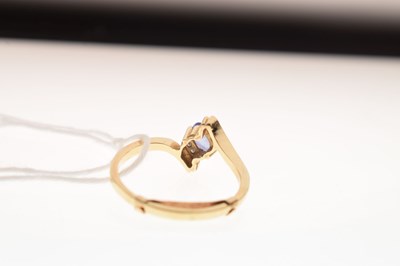 Lot 10 - Tanzanite and diamond crossover dress ring