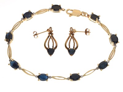 Lot 79 - Yellow metal bracelet set nine oval sapphires, stamped '14K'