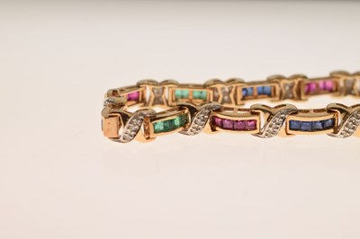 Lot 35 - Diamond, ruby, sapphire and emerald yellow metal bracelet