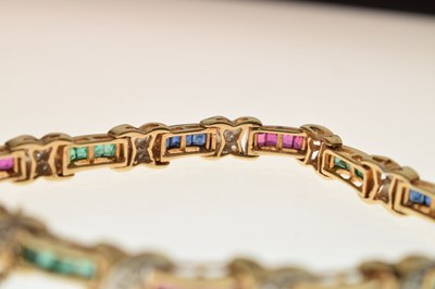 Lot 35 - Diamond, ruby, sapphire and emerald yellow metal bracelet