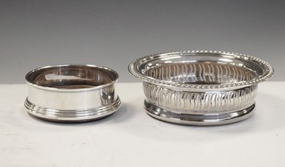 Lot 188 - Elizabeth II silver wine coasters with pierced sides, together with a smaller example