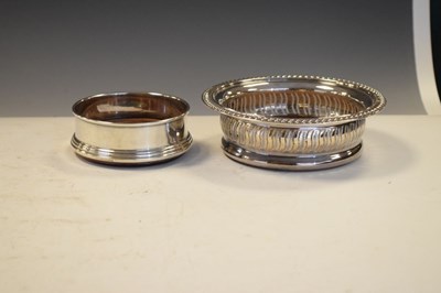 Lot 188 - Elizabeth II silver wine coasters with pierced sides, together with a smaller example