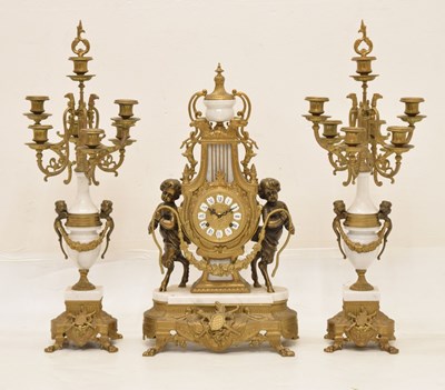 Lot 588 - Reproduction French-style three-piece gilt metal and white marble clock garniture