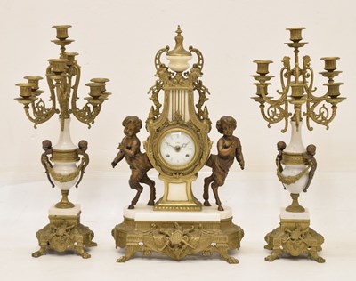 Lot 589 - Reproduction French-style three-piece gilt metal and white marble clock garniture