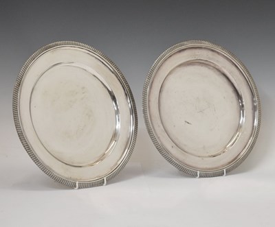 Lot 66 - Pair of George V silver circular dinner plates, sponsor's marks of Edward Barnard & Sons Ltd