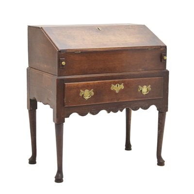 Lot 687 - George II oak bureau on stand