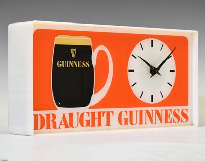 Lot 168 - Advertising - 'Draught Guinness' 1970s printed acrylic wall clock