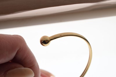 Lot 64 - 9ct yellow gold torc bangle