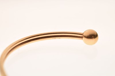 Lot 64 - 9ct yellow gold torc bangle