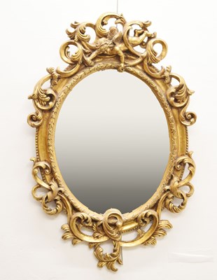 Lot 617 - Reproduction giltwood oval wall mirror