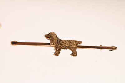 Lot 26 - Two yellow metal brooches - spaniel dog and ribbon