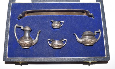 Lot 155 - Elizabeth II silver miniature four-piece tea set and tray