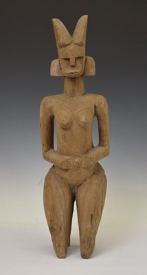 Lot 333 - African carved wooden kneeling fertility figure