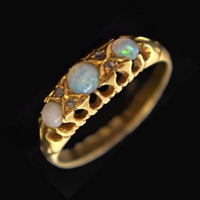 Lot 12 - Edwardian 18ct gold three-stone opal ring