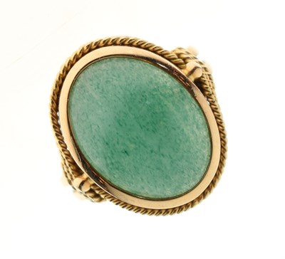 Lot 47 - Unmarked yellow metal ring set green cabochon