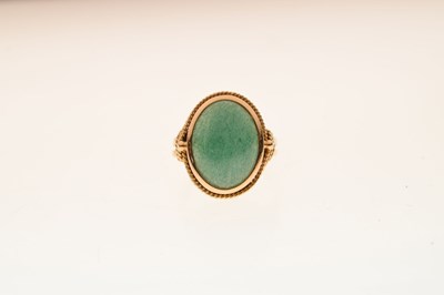 Lot 47 - Unmarked yellow metal ring set green cabochon