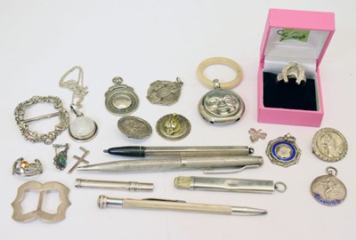 Lot 185 - Quantity of silver fobs, buttons, a child's moon-faced teething ring/rattle, etc