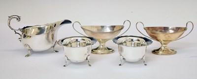 Lot 225 - Pair of Victorian silver pedestal salts, an Edward VII silver sauceboat, etc