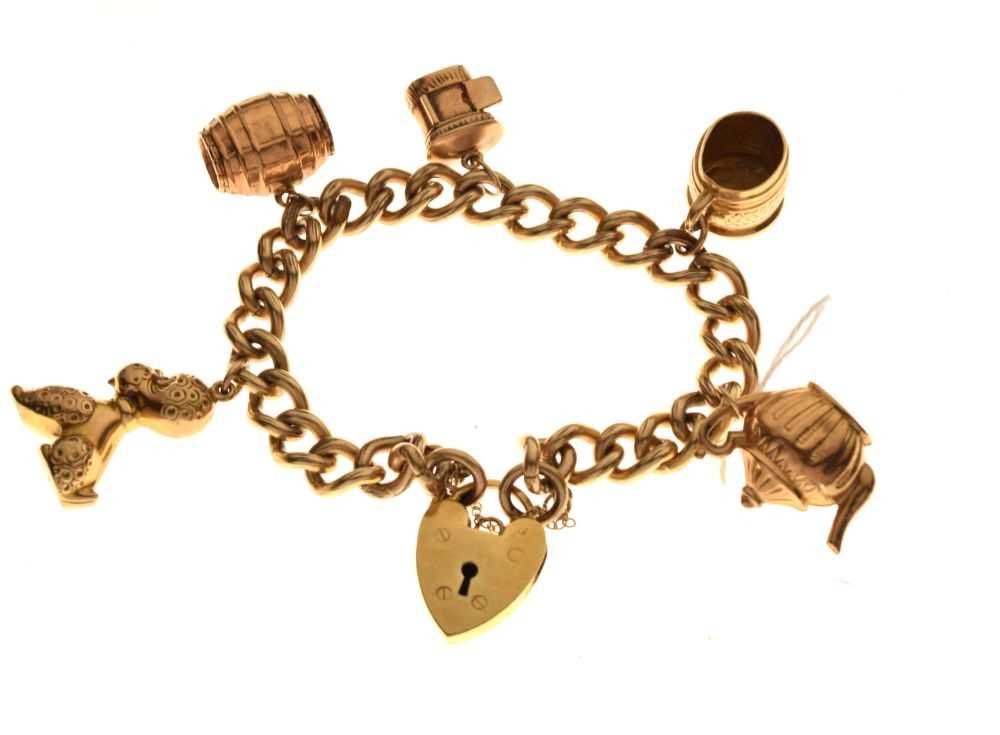 Lot 42 - Gold-plated charm bracelet with 9ct charms