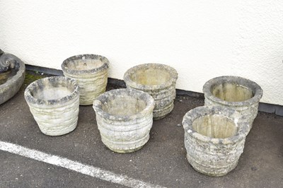 Lot 718 - Set of four composite stone garden planters and a pair of composite stone planters