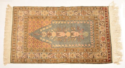 Lot 573 - Small Middle Eastern blue and yellow ground prayer rug