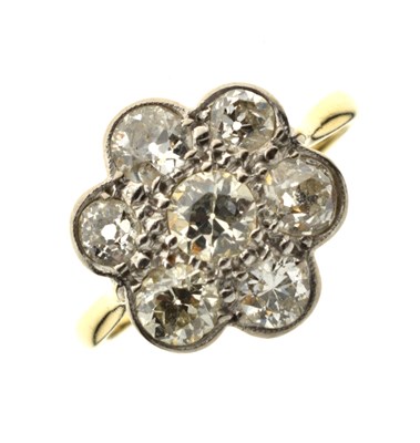 Lot 11 - Diamond 18ct yellow gold and platinum flower head ring