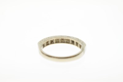 Lot 30 - Sapphire and diamond 18ct white gold half eternity ring