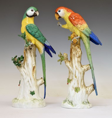 Lot 323 - Pair of 20th century Continental porcelain models of parrots, in the Meissen style