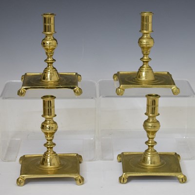 Lot 400 - Four turned brass candlesticks