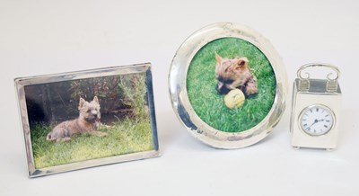 Lot 205 - Edward VII silver desk clock, and two photograph frames