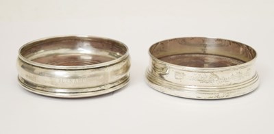 Lot 193 - Two Elizabeth II silver mounted wine coasters