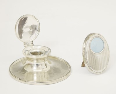 Lot 195 - Edward VIII silver capstan inkwell and a George V silver mounted oval photo frame