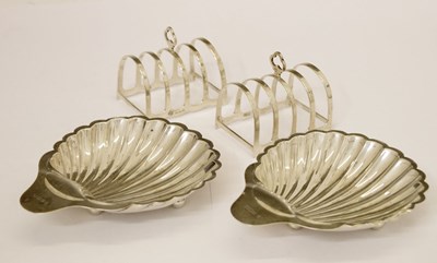 Lot 264 - Pair of George V butter shell dishes and toastracks