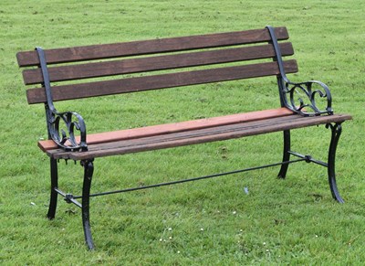 Lot 732 - Modern two seater teak garden bench with cast metal ends