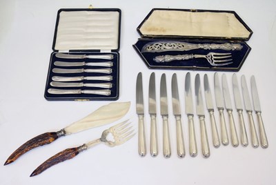 Lot 235 - Cased set of six George V silver handled butter knives, cased pair of silver plated fish servers, etc