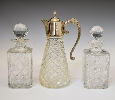 Lot 473 - Silver plated and cut glass claret jug, together with two cut glass decanters