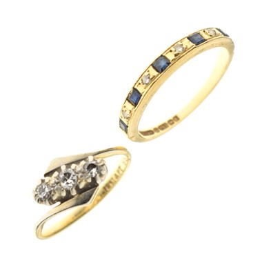 Lot 50 - Diamond three-stone crossover ring, and a sapphire and diamond 18ct gold half eternity ring (2)