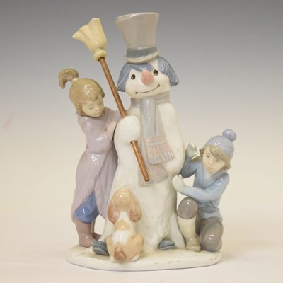 Lot 509 - Lladro - Porcelain snowman figure group