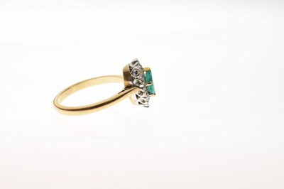 Lot 40 - Emerald and diamond 18ct gold cluster ring