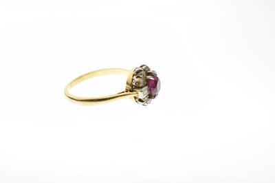 Lot 41 - Ruby and diamond 18ct gold cluster ring